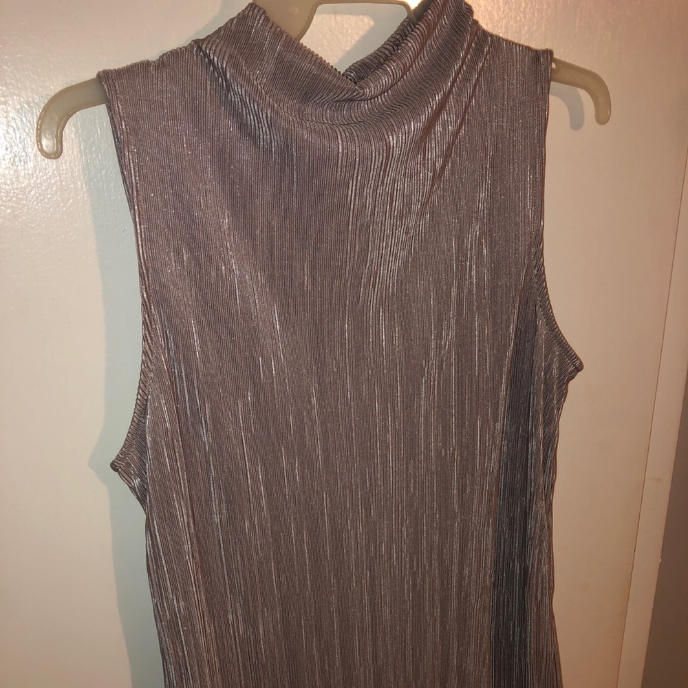 Ann Taylor purple shimmery turtle neck tank top. Size medium. Never worn.